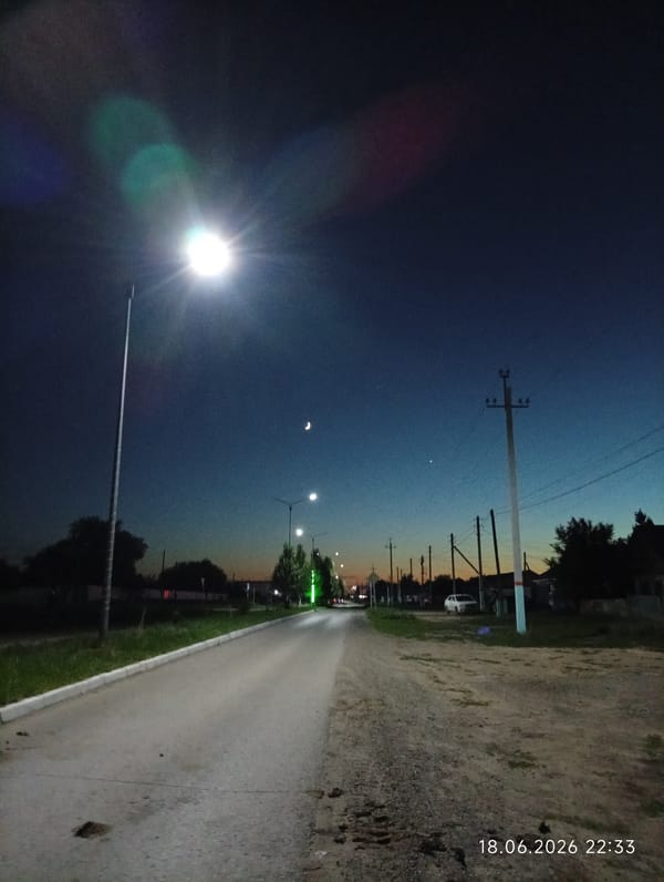 Dusk settles over the quiet streets of Qobda, Kazakhstan
