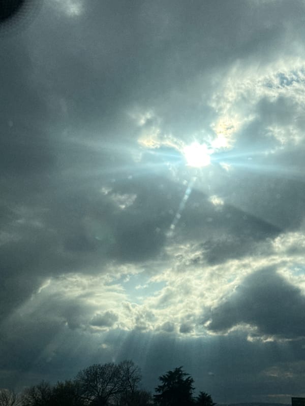 Sunlight breaks through clouds over Aksakovo, Bulgaria