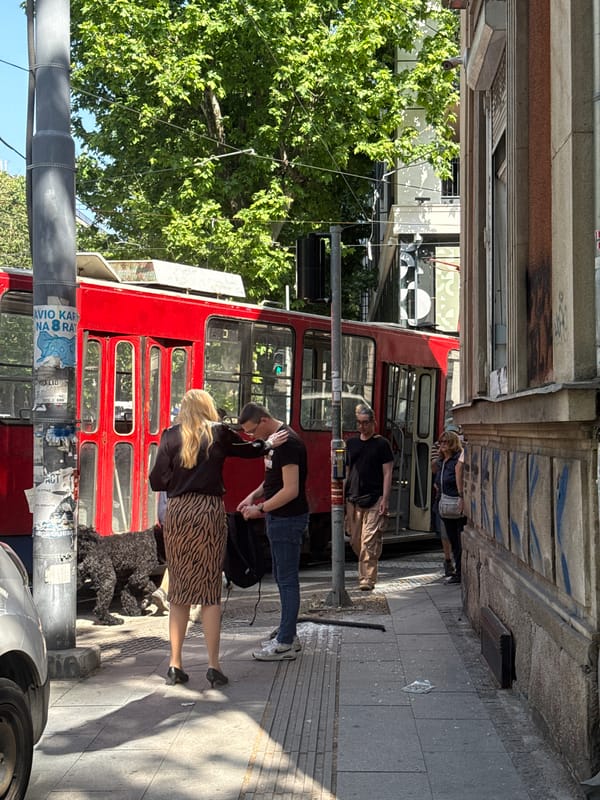Red tram crashes into Belgrade building, witnesses gather