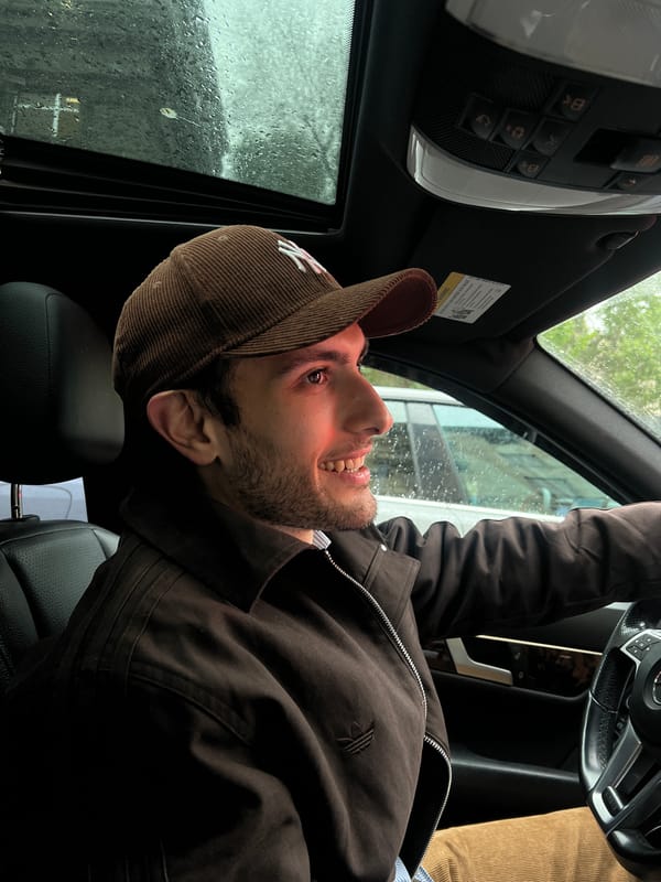 Driver observed in Mercedes during afternoon rain in Yerevan