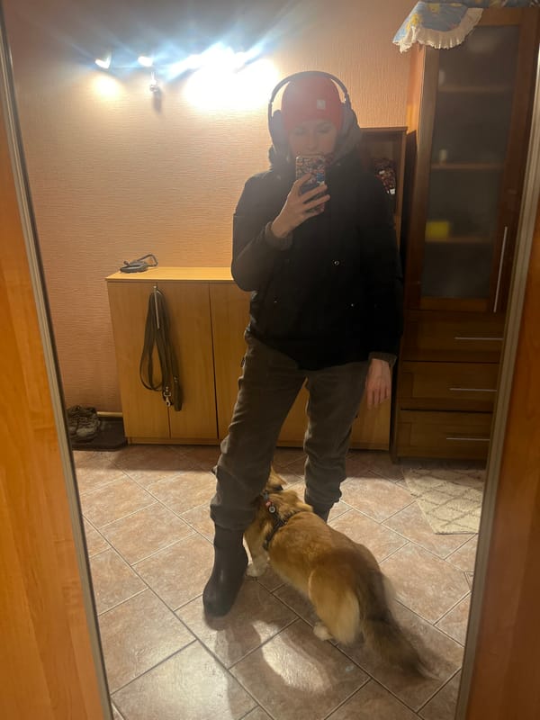 Person takes selfie with corgi in Novosibirsk home