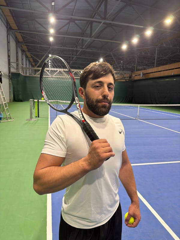 Tennis practice session documented at Krasnoyarsk indoor court facility
