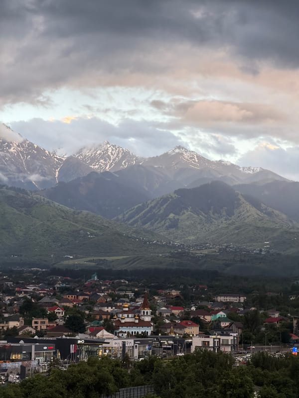Almaty residents document city views with Tian Shan mountains backdrop