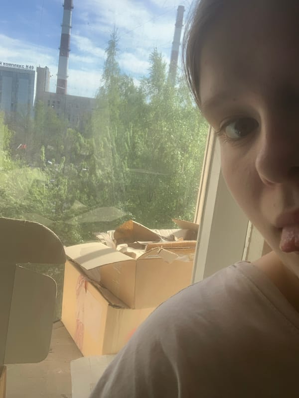 Person documents afternoon moments indoors in Russian suburb