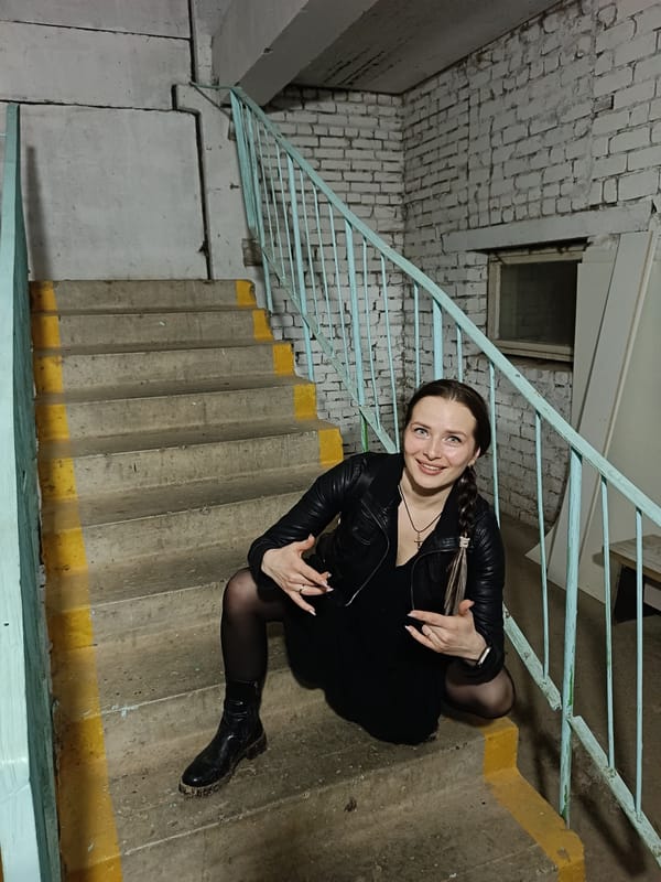 Woman photographed in stairwell and with meal in Chaikovsky
