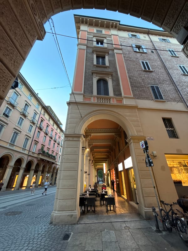 Evening wander through Bologna's porticoes, piazzas, and aperitivo hour