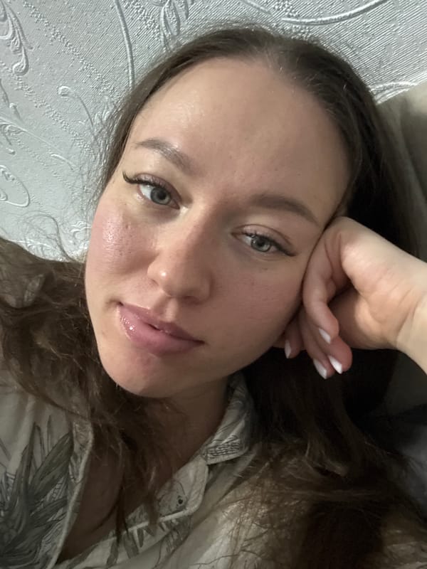 Woman takes indoor selfie portrait in Ferma, Russia