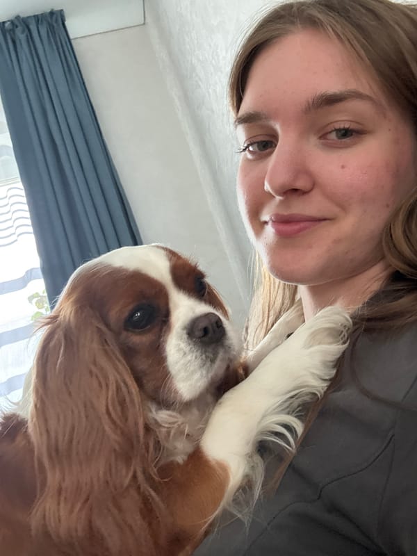 Woman enjoys morning cuddle session with pets in Russia