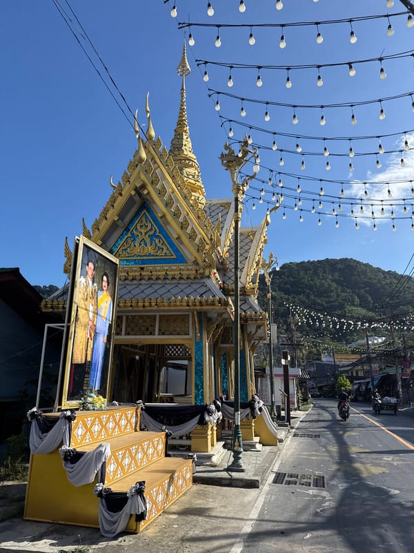 Patong street and shrine scenes near a gilded Buddhist structure