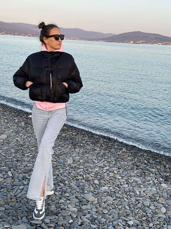 Woman in casual attire stands on Novorossiysk beach