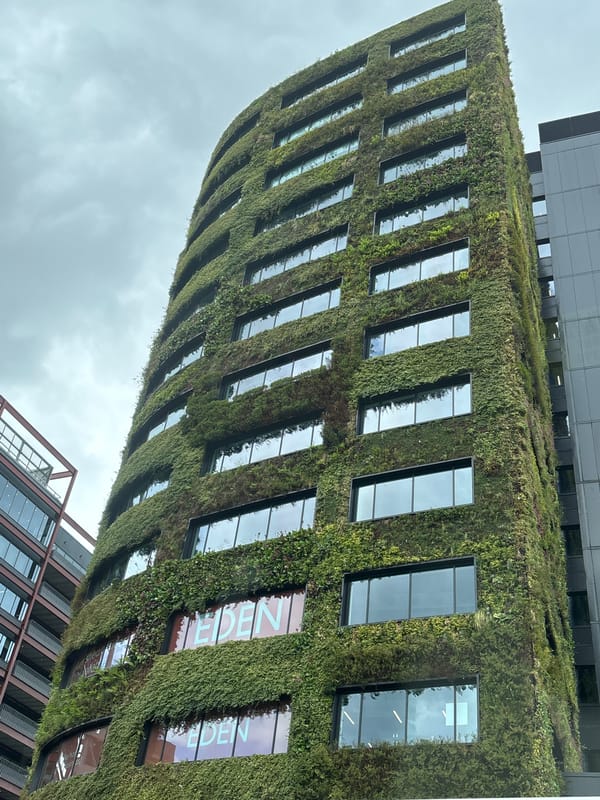 Modern green-facade building documented in Salford