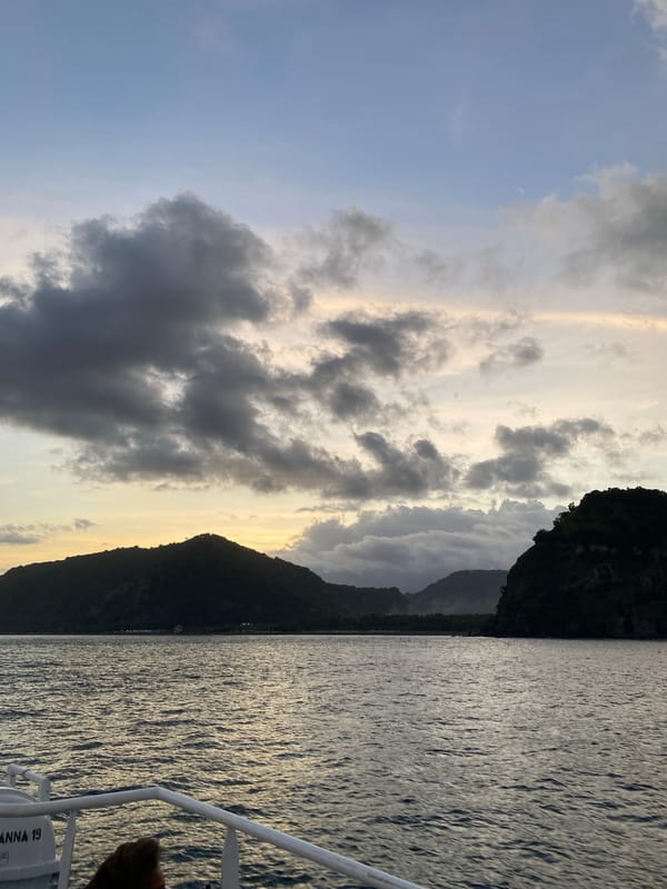 Boat journey captured off Karangasem coast under cloudy skies