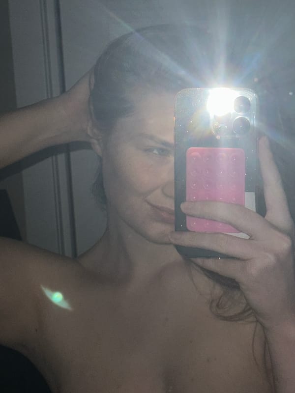 Mirror selfie taken in Kazan obscured by camera flash