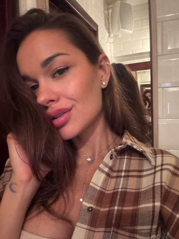 Casual bathroom selfies in Moscow, same outfit, same moment.