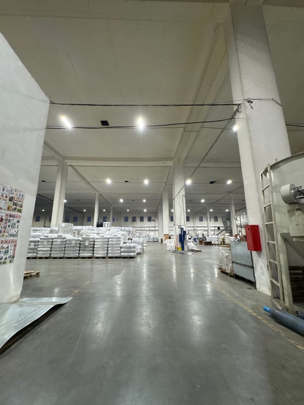 Inside and outside a Perm plastics facility at dusk