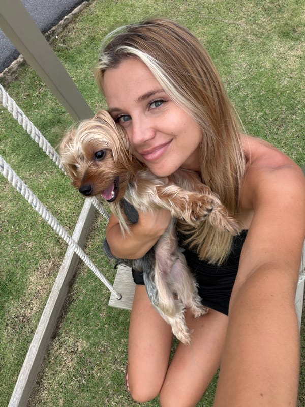 Goofing around with a Yorkshire Terrier outdoors in Thailand