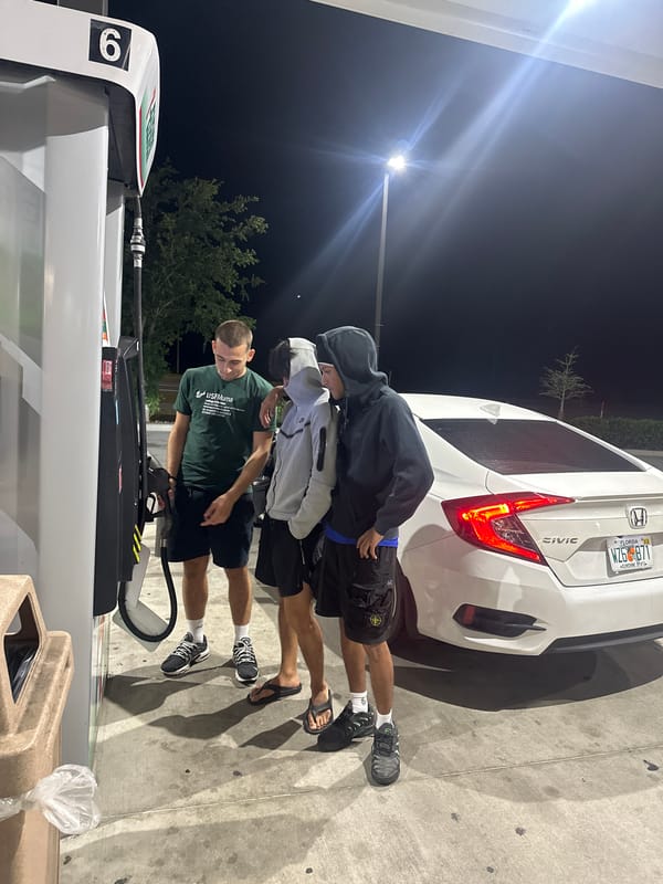 Three men fuel white Honda at Florida 7-Eleven