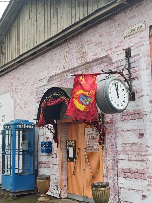Street scenes documented in Ольгово, Russia show Soviet-era architecture