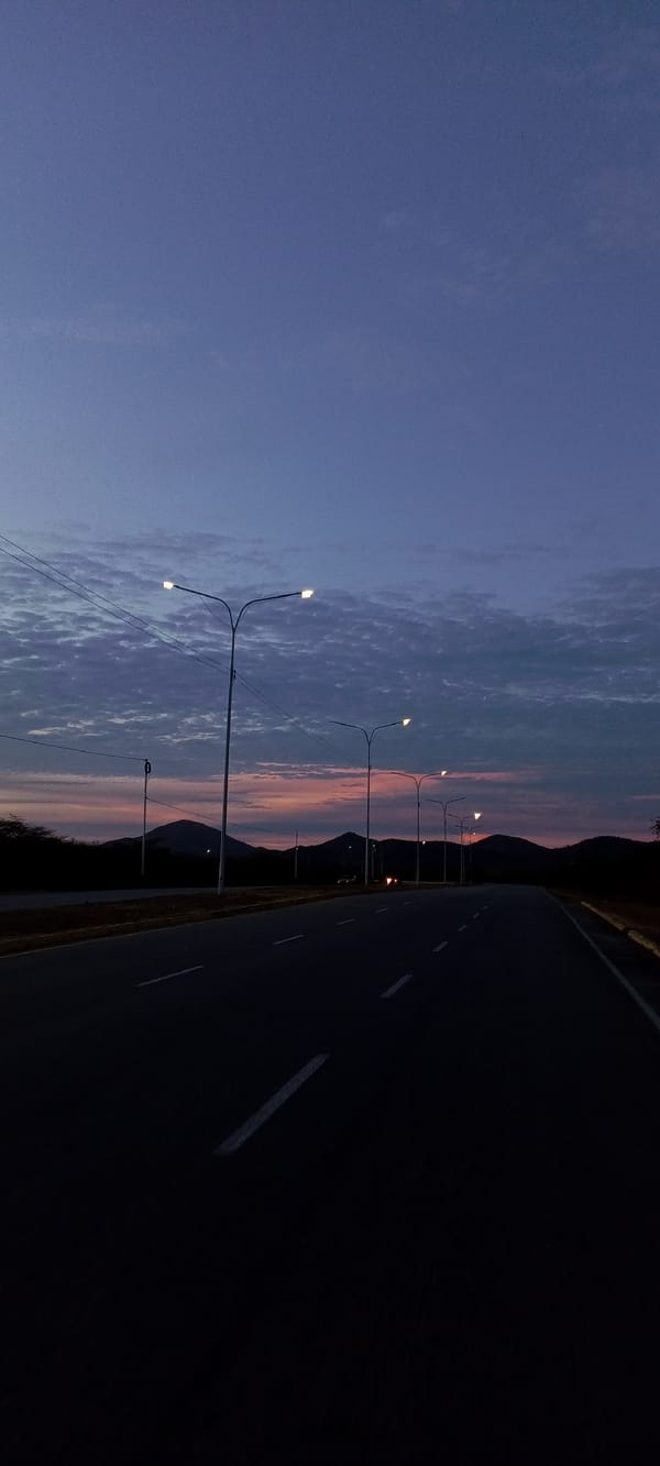 Venezuelan roads captured under twilight skies near mountains
