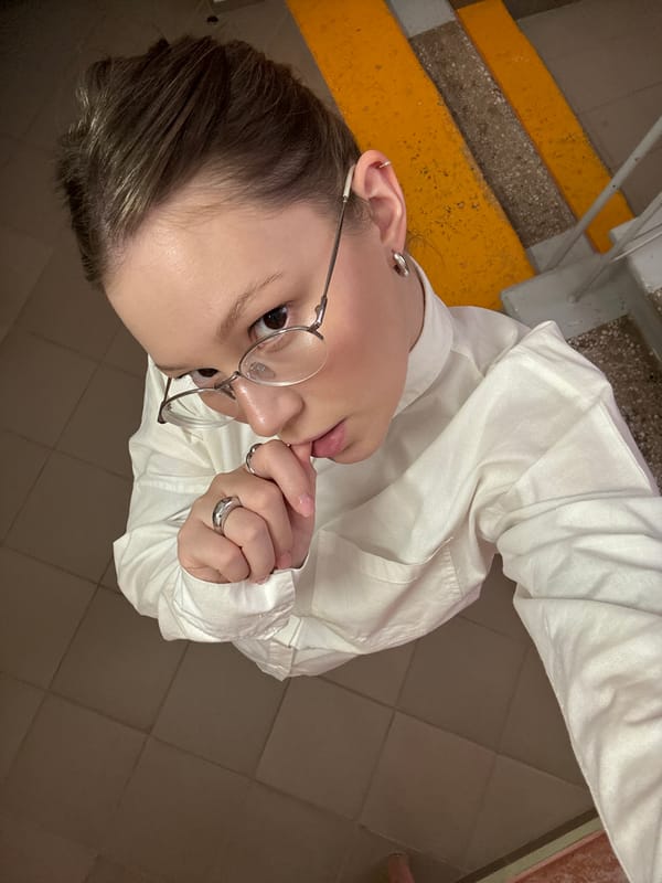 Person in white shirt observed near colorful stairs