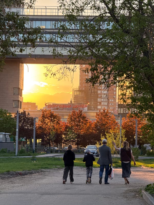 Evening pedestrians and spring blooms captured in Moscow sunset