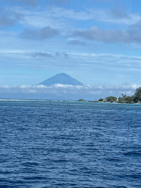 Indonesian coastal waters see routine boat activity, dock scenes