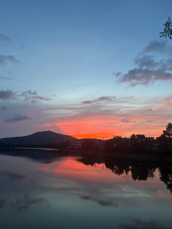Sunset observed over water in Baan Harn, Thailand