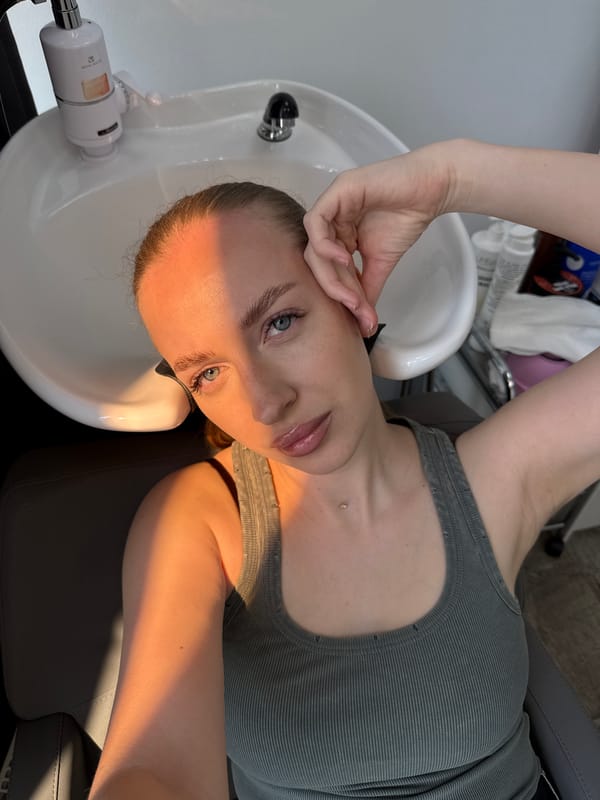 Woman takes selfie at hair salon in Petropavlovsk-Kamchatsky
