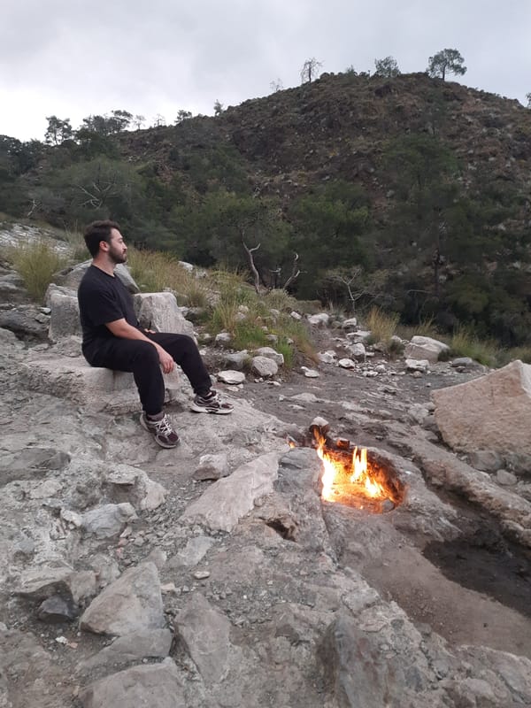 Visitor observes natural flames at Turkey's ancient Chimaera site