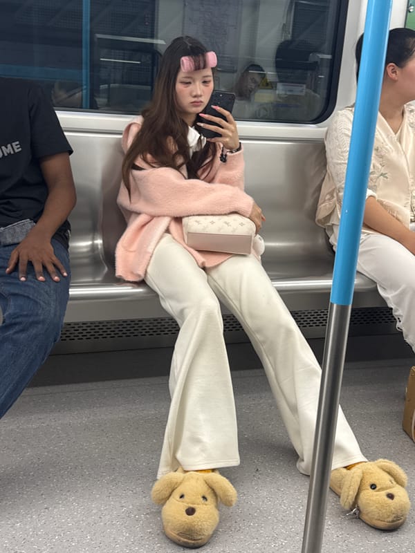 Woman takes selfies while relaxing on train seats