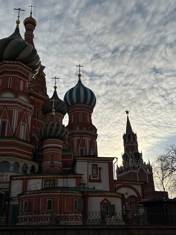 Tourists photograph St. Basil's Cathedral in Moscow's Red Square