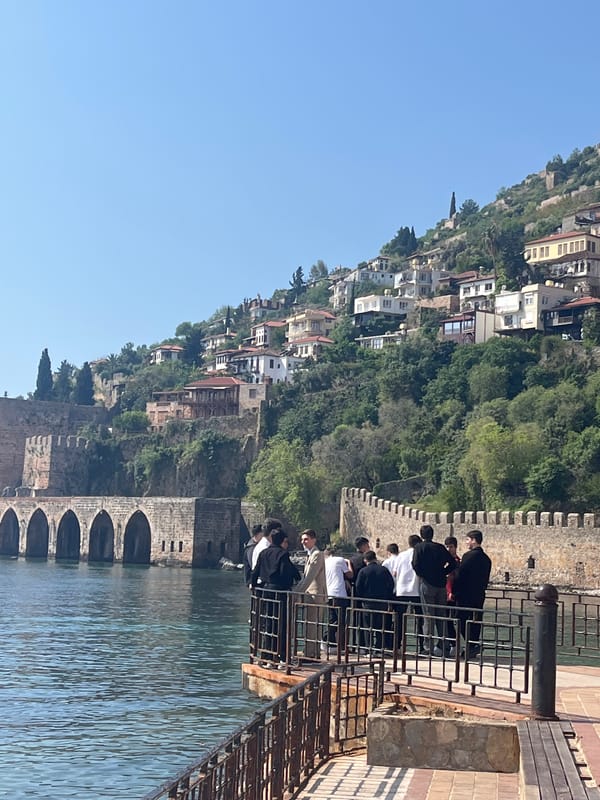 Young group gathers at scenic Alanya overlook on sunny morning