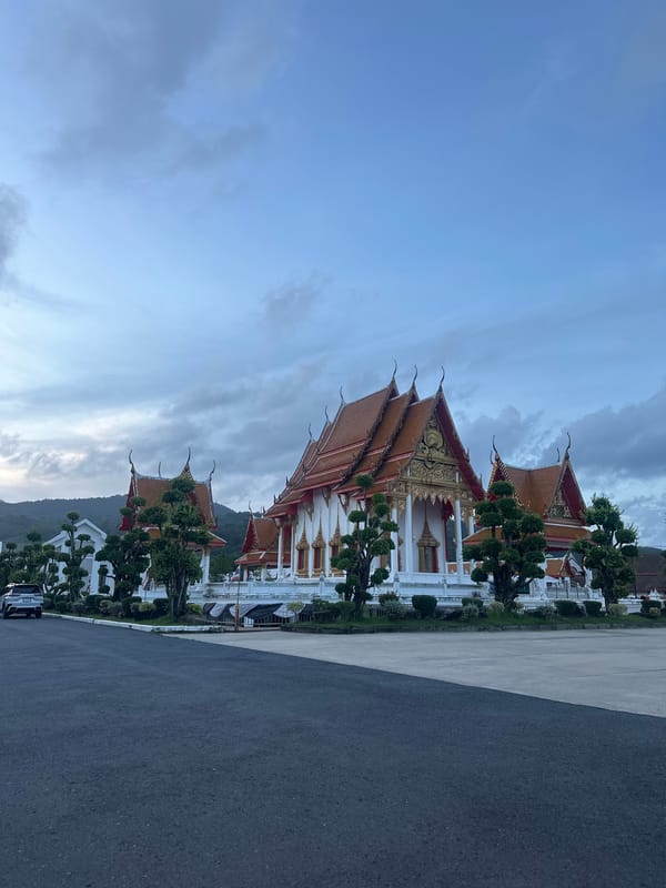 Visitors document prayer scenes at Wat Chalong temple Thailand