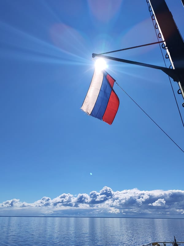 Russian flag flies against clear sky in Pavlokovo