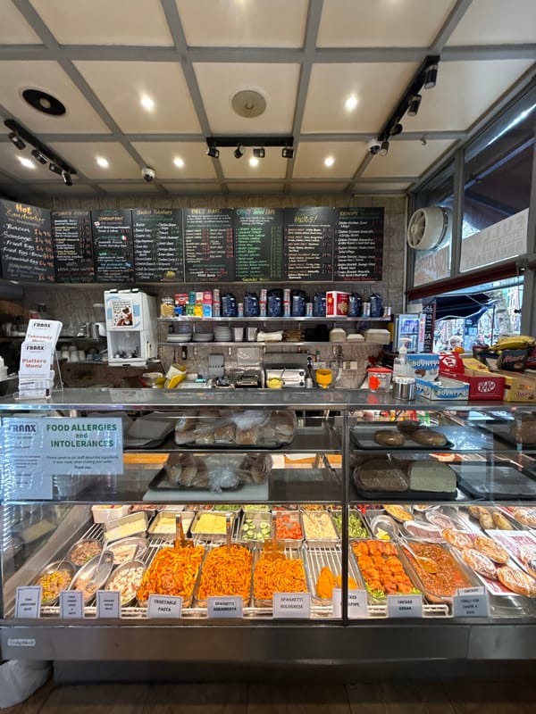 London food stall displays prepared meals in bright setting