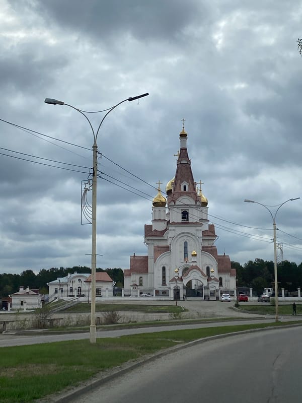 Church with golden domes observed in Shelekhov, Russia