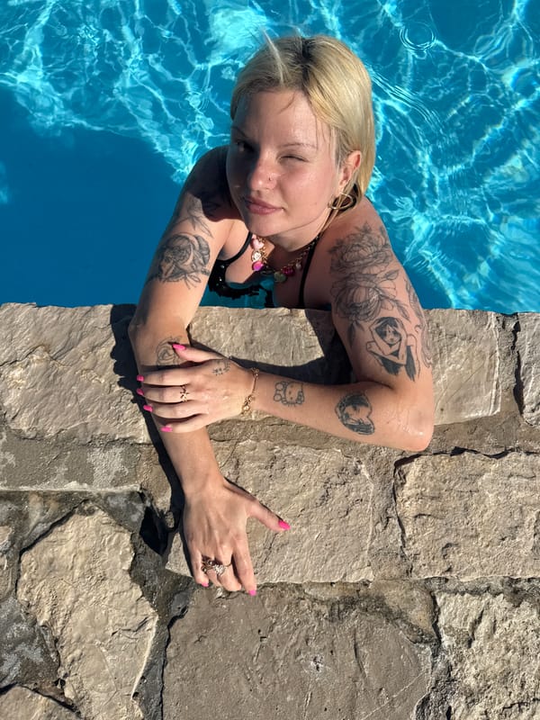 Woman enjoys afternoon swim at Prijevor beach resort