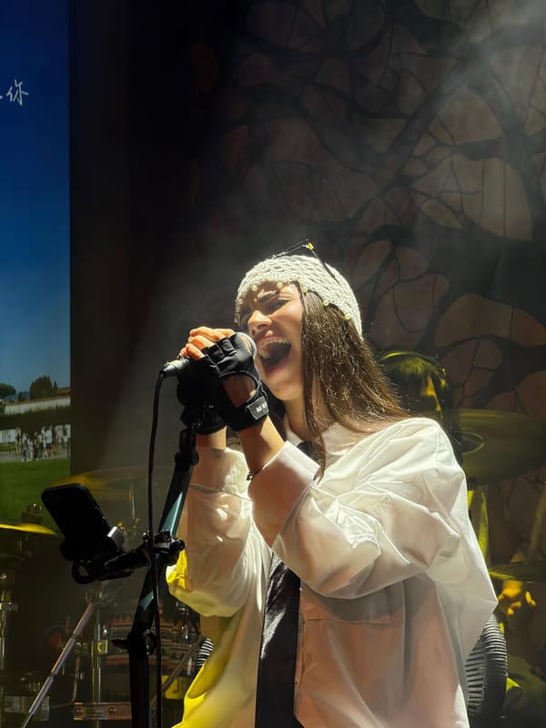 Stage performance in Liangjiang with distinctive pearl-adorned hat