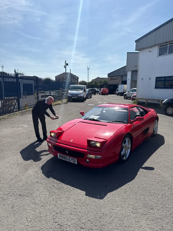 Red Ferrari draws attention at Cardiff industrial site