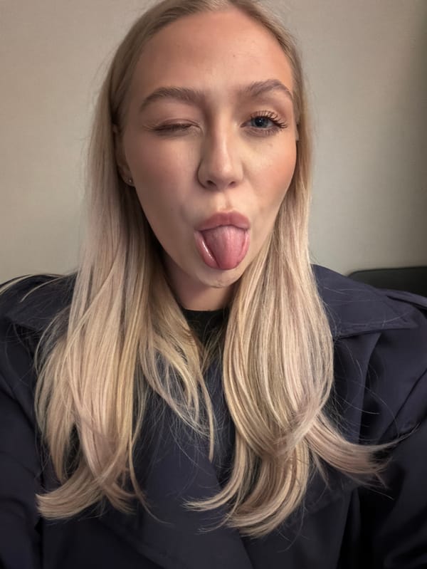Blonde woman poses for multiple selfies in Saint Petersburg