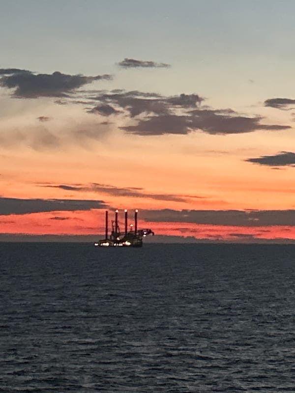 Maritime sunset observed with gradient sky colors