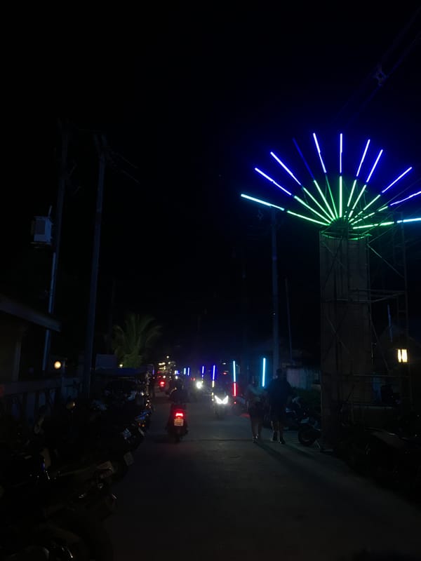 Evening market scene documented in Baan Mae Nam, Thailand