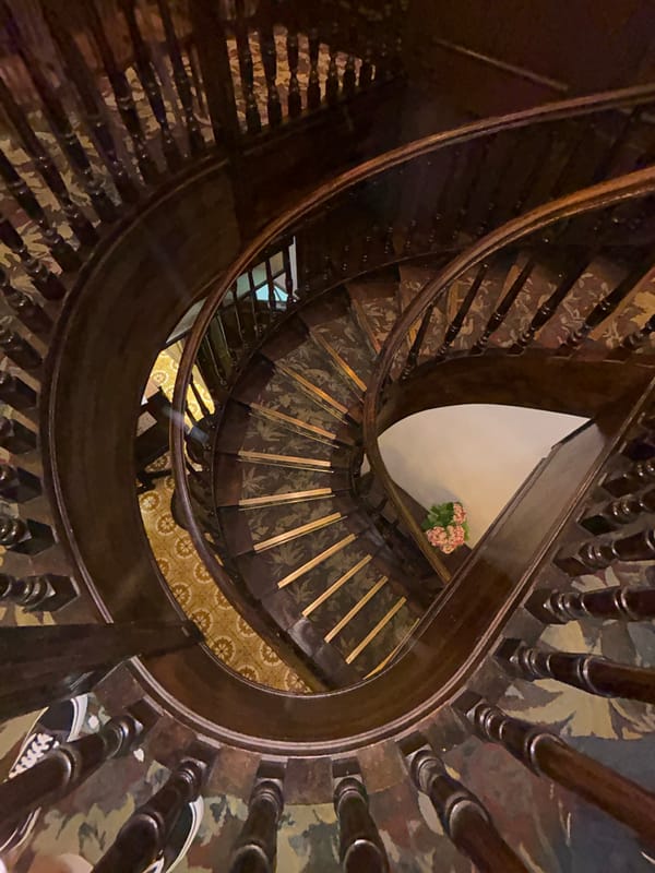 Ornate staircases and wine bars on a Paris evening