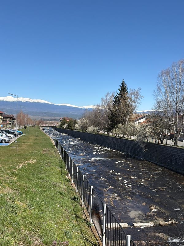 River flows through stone channel in Bansko, Bulgaria
