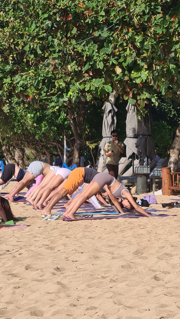 Beach yoga session along the Denpasar coastline, Bali