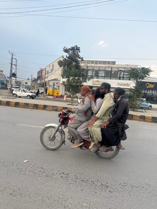 Multiple riders share motorcycles on Quetta streets