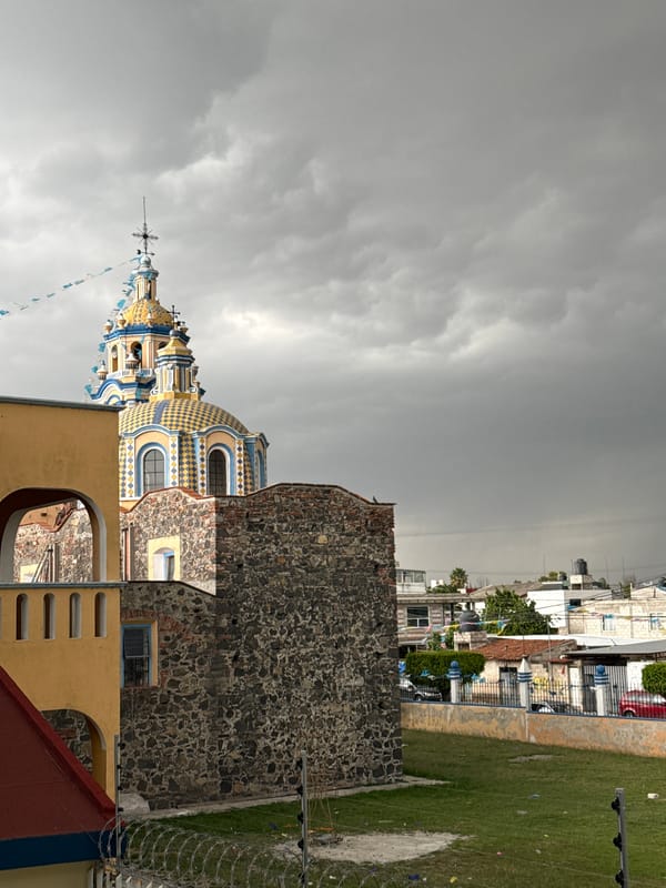 Evening life captured in Mexican town: church, children drawing