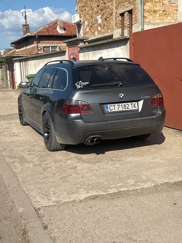 Gray BMW with fishing sticker parked in Sarnevo, Bulgaria