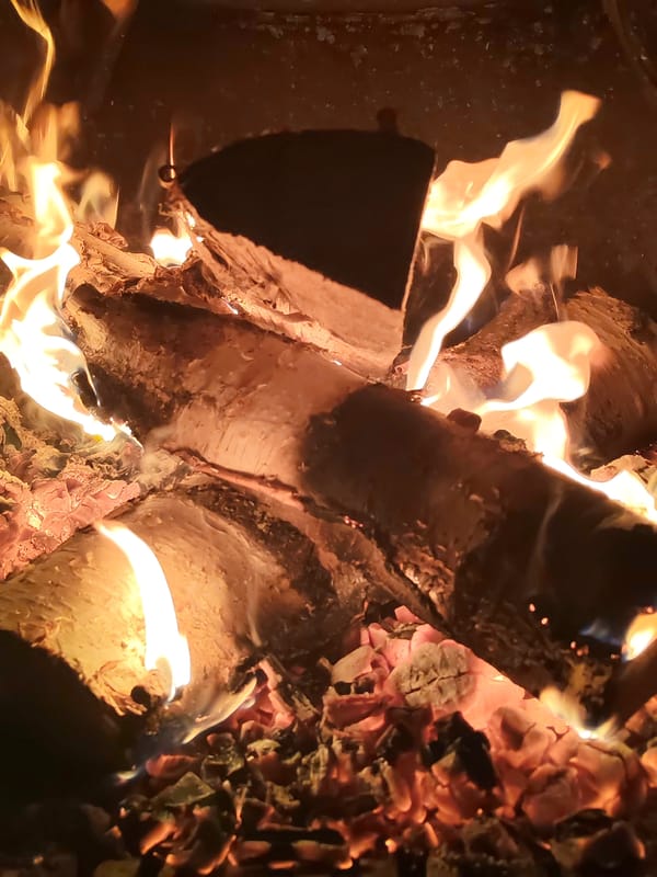 Couple enjoys traditional sauna experience with felt hats
