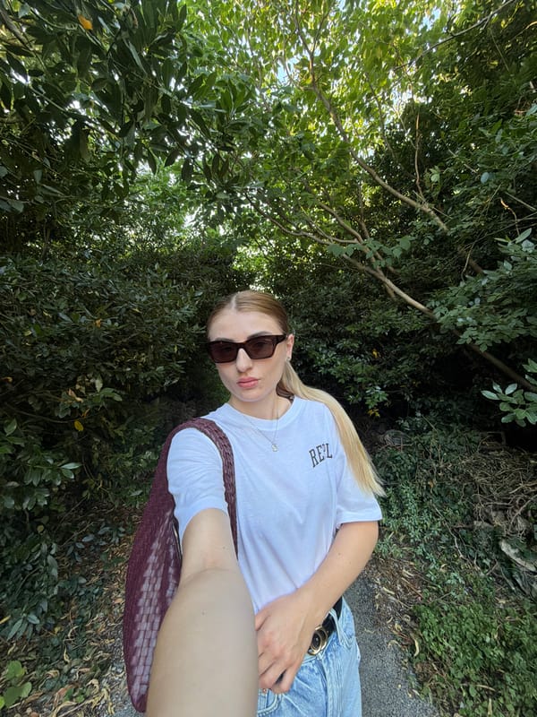 Selfie series outdoors, white tee and woven bag